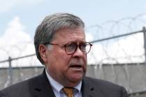 Attorney General William Barr speaks to reporters after a tour of a federal prison on July 8, 2 ...