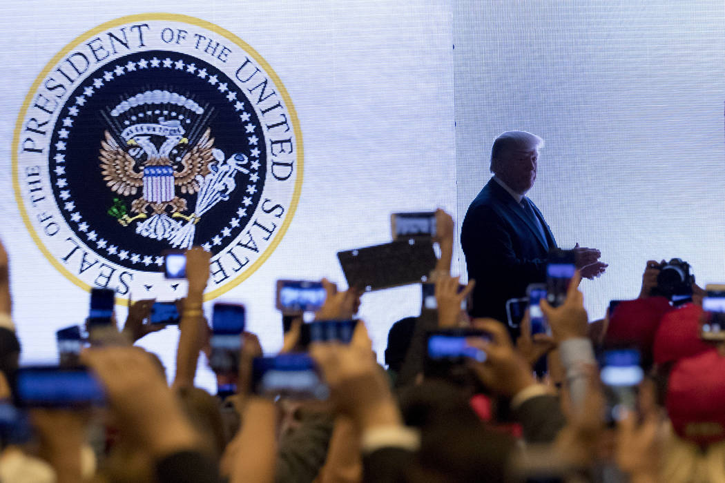 In a July 23, 2019, photo, President Donald Trump takes the stage at Turning Point USA Teen Stu ...