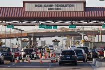 FILE - In this Nov. 13, 2013 file photo vehicles file through the main gate of Camp Pendleton M ...