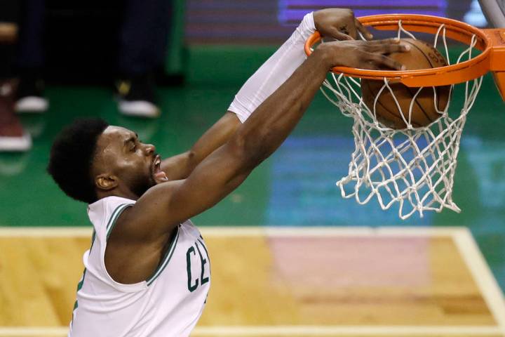 Boston Celtics guard Jaylen Brown dunks against the Cleveland Cavaliers during the second half ...