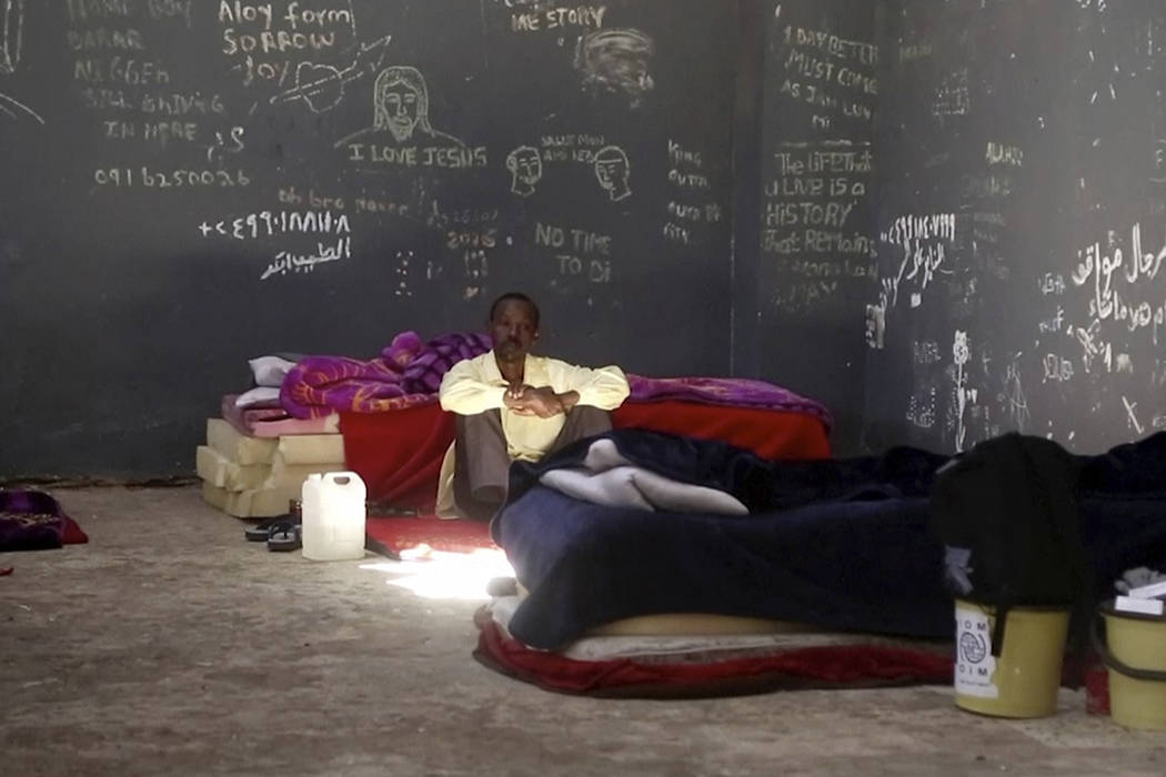 In this Wednesday, July 17, 2019 frame grab from video, a migrant rests in a detention center i ...