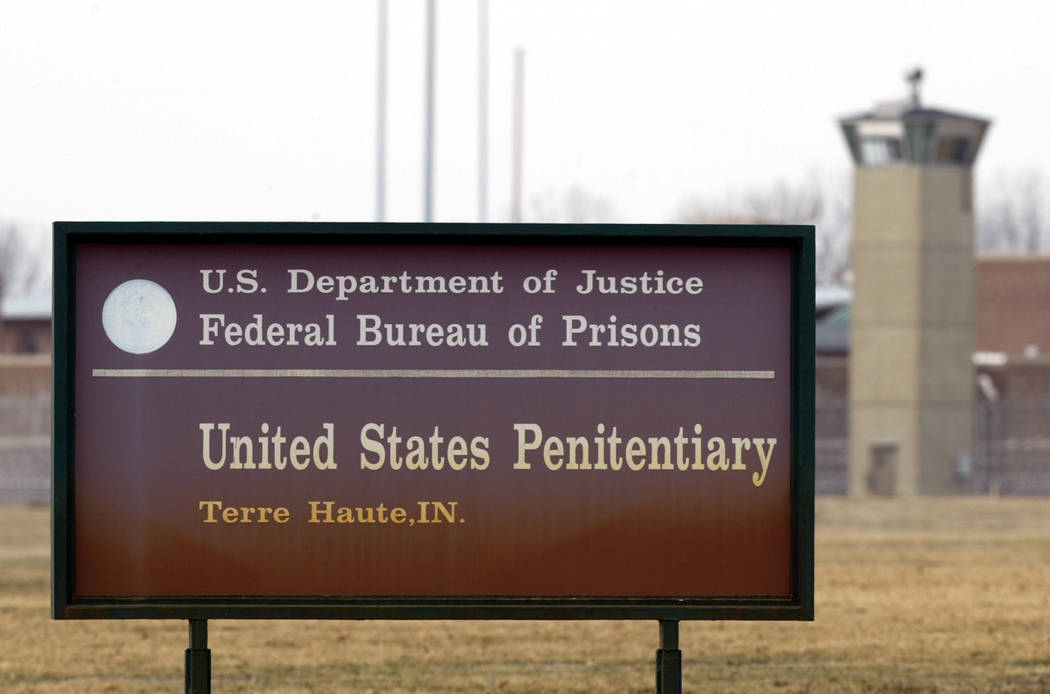 In a March 17, 2003, file photo, the guard tower flanks the sign at the entrance to the U.S. Pe ...