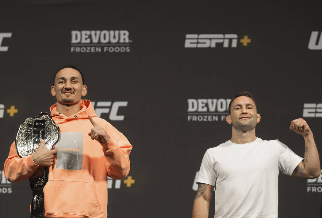 UFC featherweight champion Max Holloway, left, and UFC featherweight contender Frankie Edgar ta ...