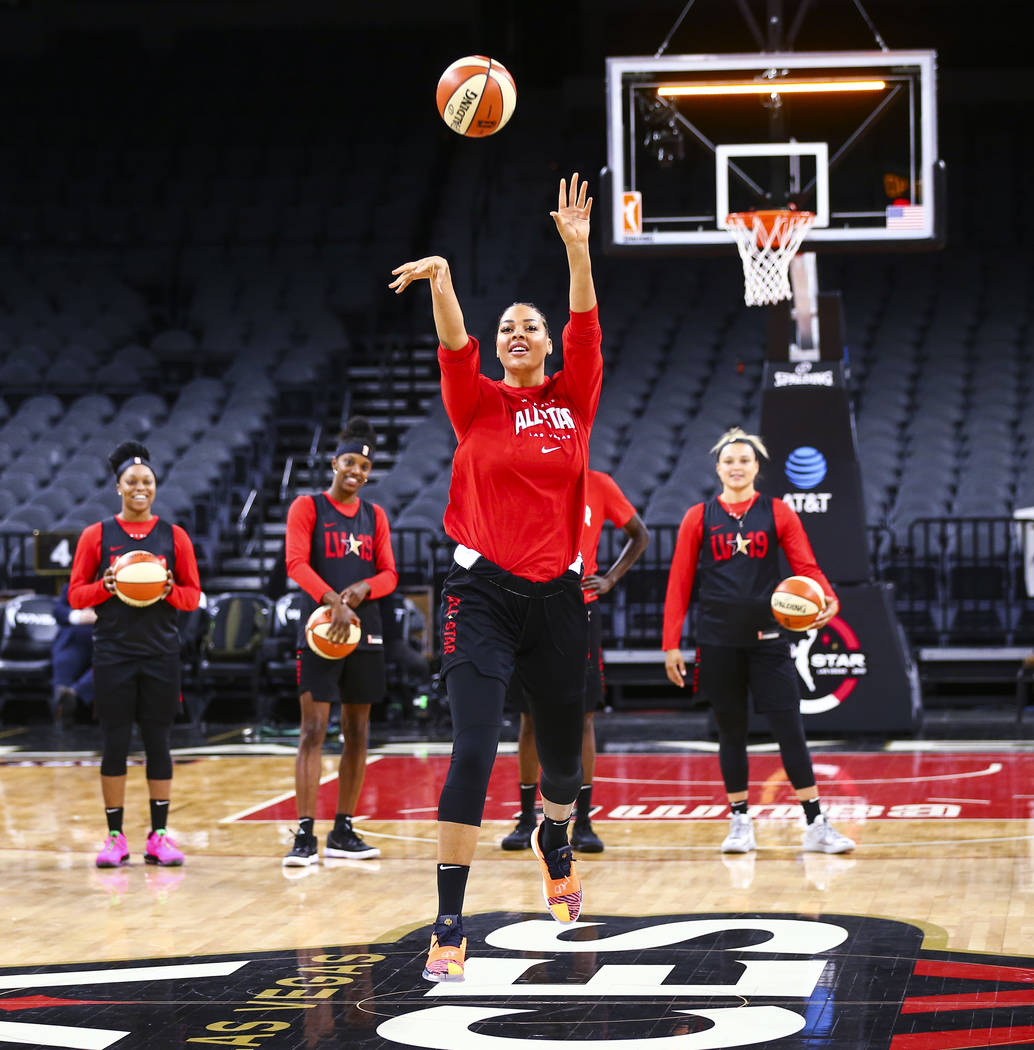 Las Vegas Aces' Liz Cambage attempts a half-court shot during practice ahead of the WNBA All-St ...