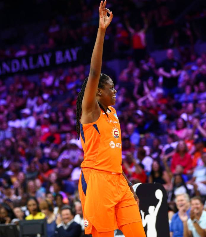 Connecticut Sun's Jonquel Jones celebrates after competing in an obstacle course involving pass ...