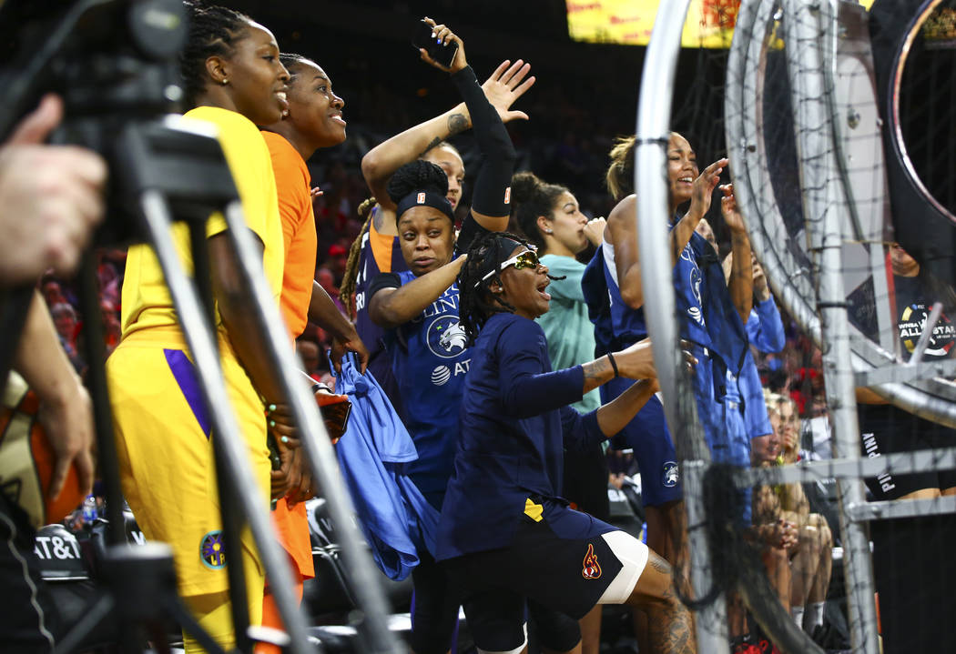 Players jump out of the way of a stray ball as they take turns competing during the WNBA All-St ...