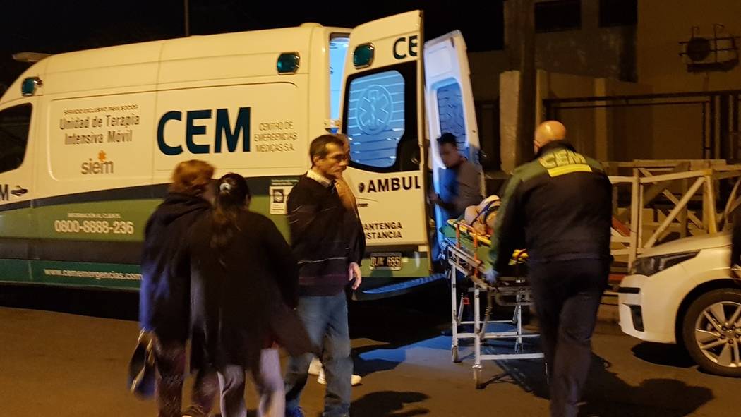 Argentine boxer Hugo Santillan is placed on an ambulance after he collapsed at the end of a WBC ...