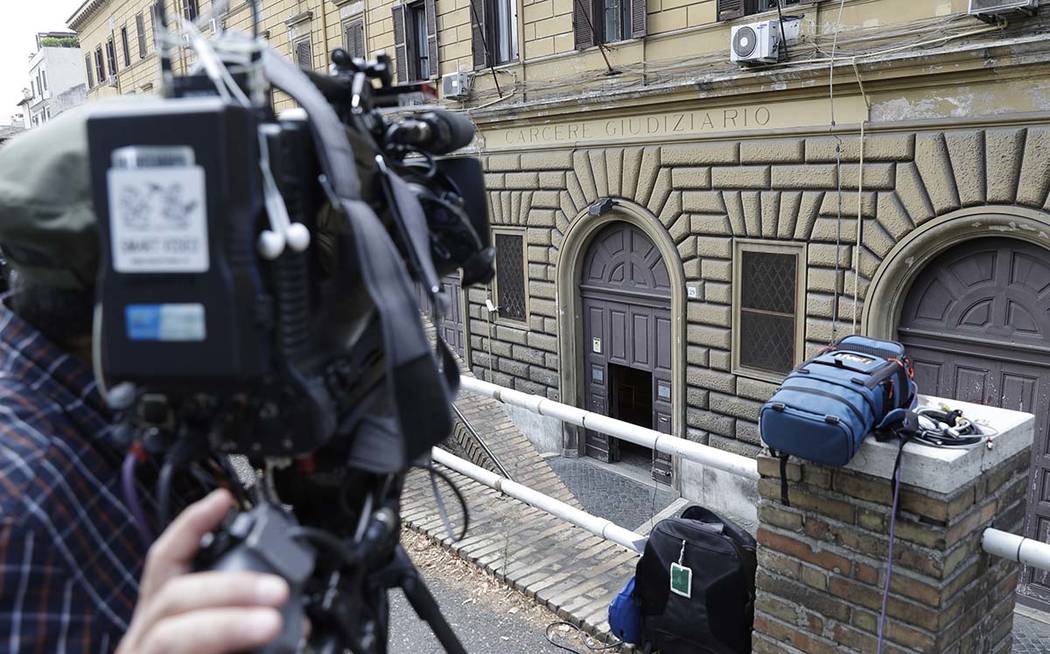 A cameraman waits at the entrance of the Regina Coeli prison, where the alleged murderer of car ...