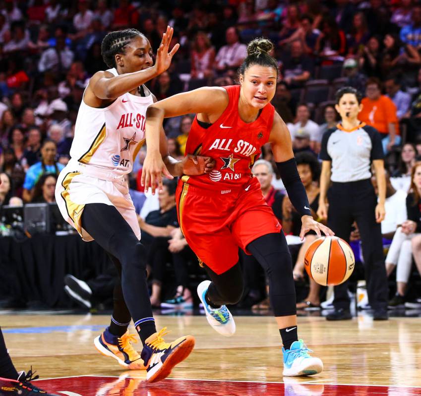 Las Vegas Aces' guard Kayla McBride drives to the basket against Los Angeles Sparks' Nneka Ogwu ...