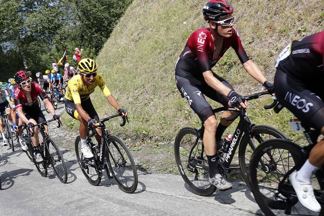 Colombia's Egan Bernal wearing the overall leader's yellow jersey climbs toward Val Thorens wit ...