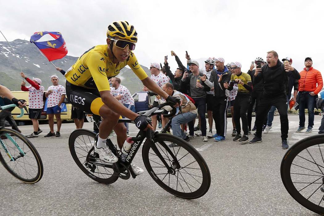 Colombia's Egan Bernal wearing the overall leader's yellow jersey climbs toward Val Thorens dur ...