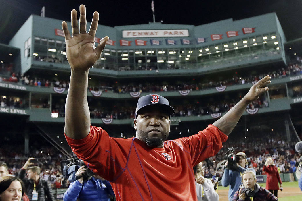 In this Oct. 10, 2016, file photo, Boston Red Sox's David Ortiz waves from the field at Fenway ...