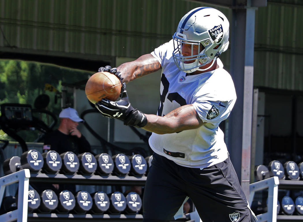 Oakland Raiders tight end Darren Waller (83) catches a pass during a drill at the NFL team's tr ...