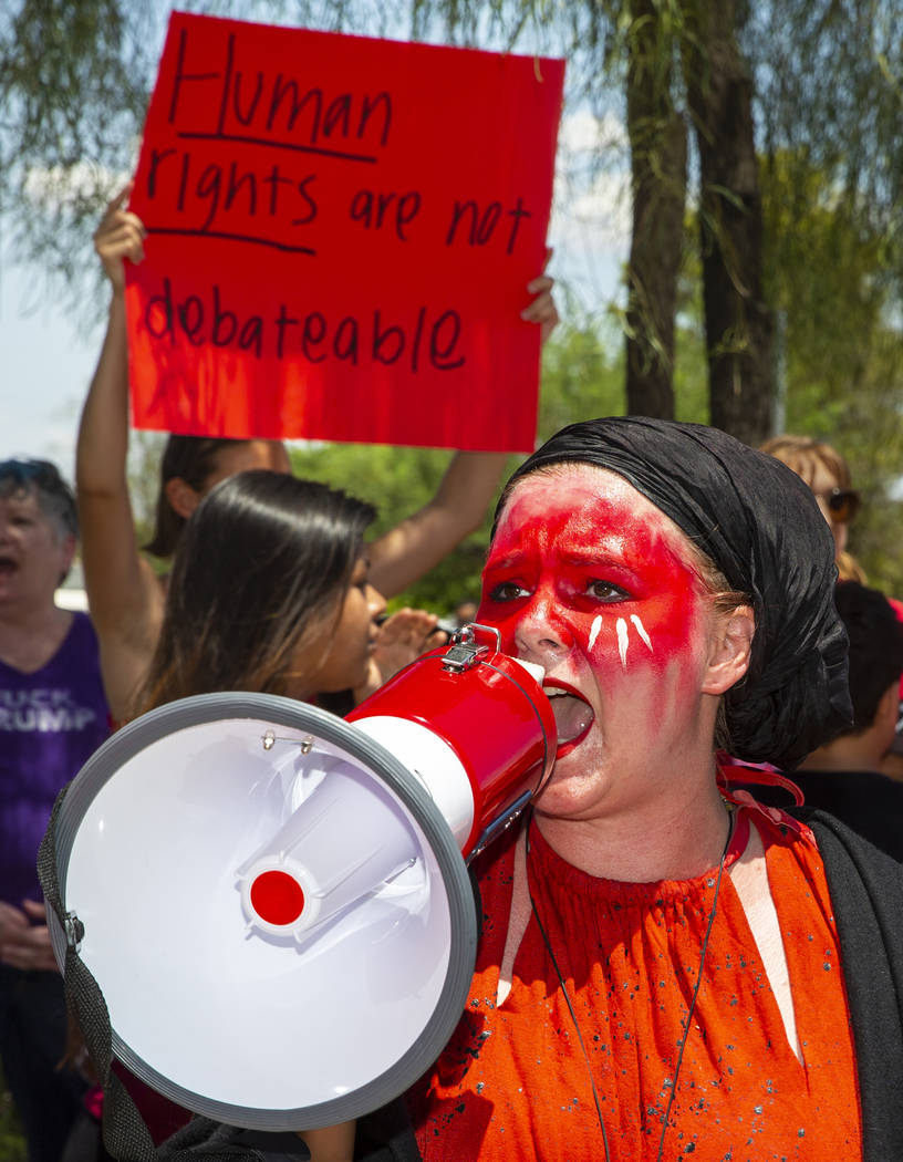 Melissa Akiima Eggstaff of Red Rage Protest for Kids in Cages yells out chants for responses du ...