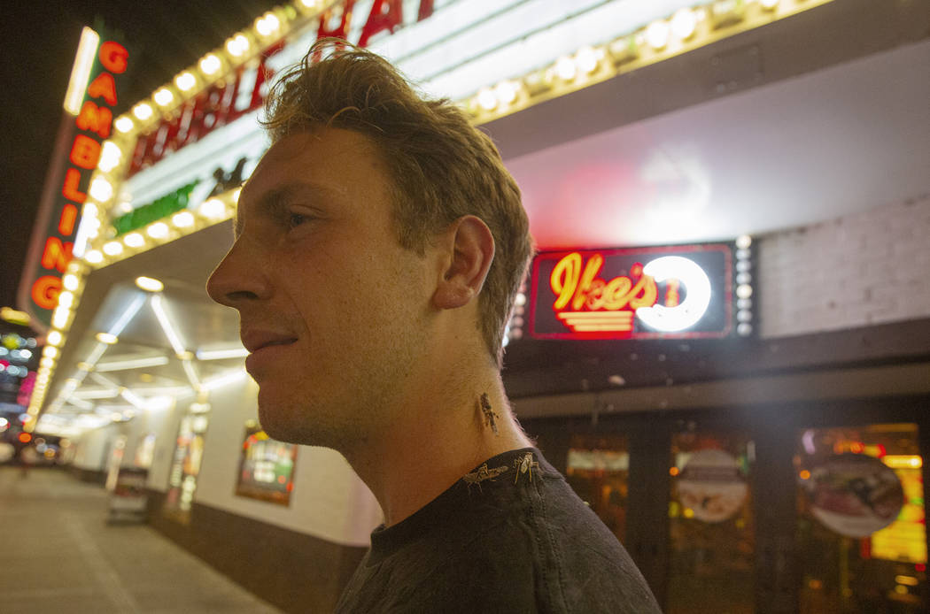 John Smirk poses with grasshoppers outside the El Cortez on Sunday, July 28, 2019 in Las Vegas. ...