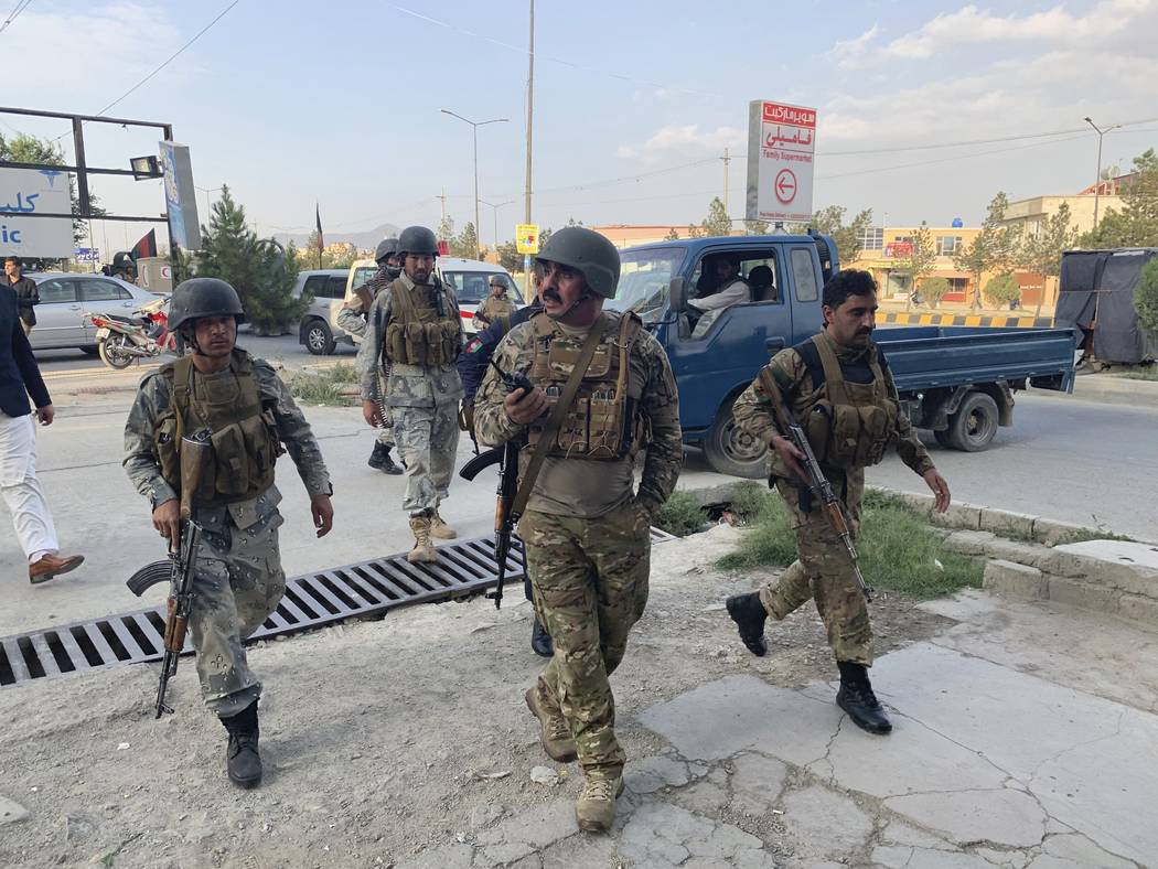 Afghan security forces arrive at the site of attack in Kabul, Afghanistan, Sunday, July 28, 201 ...