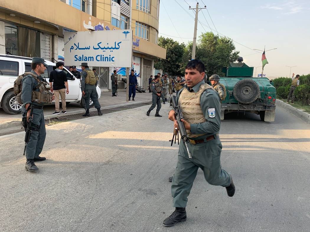 Afghan security forces arrive at the site of an attack in Kabul, Afghanistan, Sunday, July 28, ...