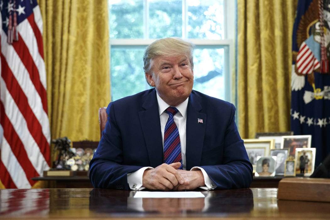 President Donald Trump pauses as he speaks in the Oval Office of the White House in Washington, ...