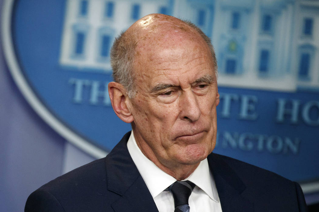 FILE - In this Aug. 2, 2018, file photo, Director of National Intelligence Dan Coats listens du ...