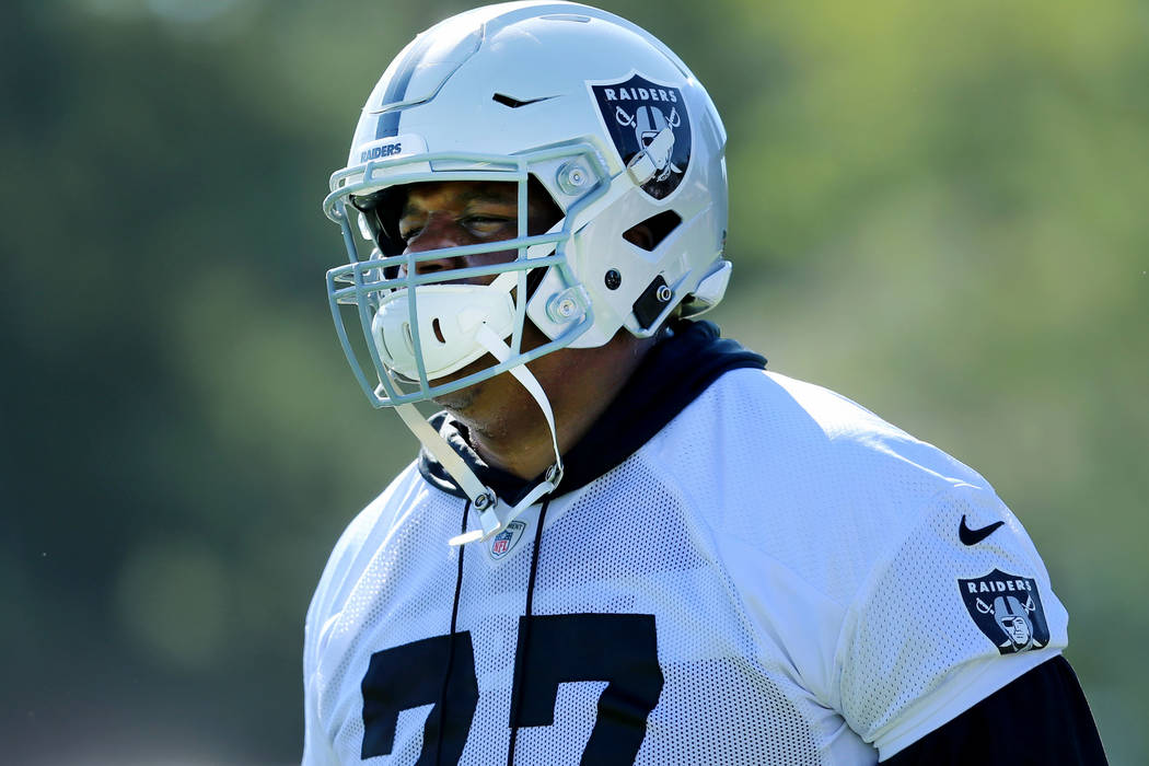 Oakland Raiders offensive tackle Trent Brown (77) warms up during the NFL team's training camp ...