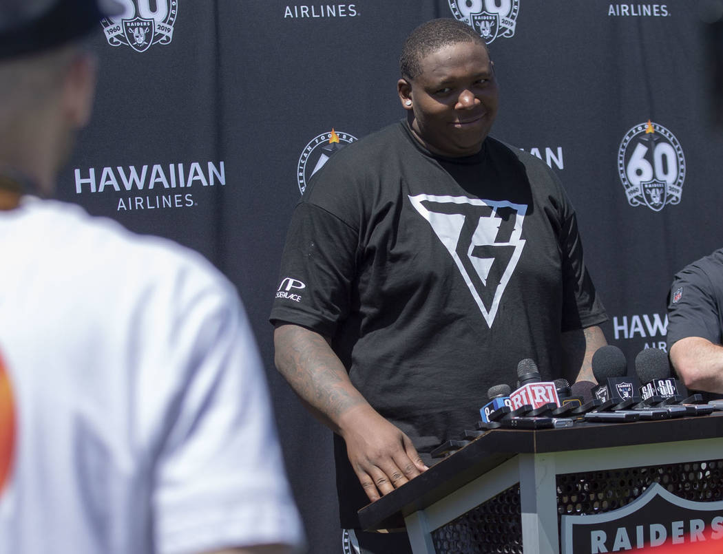 Oakland Raiders offensive tackle Trent Brown (77) takes questions during the NFL team's trainin ...