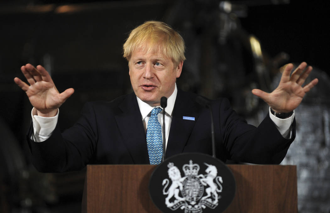 Britain's Prime Minister Boris Johnson gestures during a speech on domestic priorities at the S ...