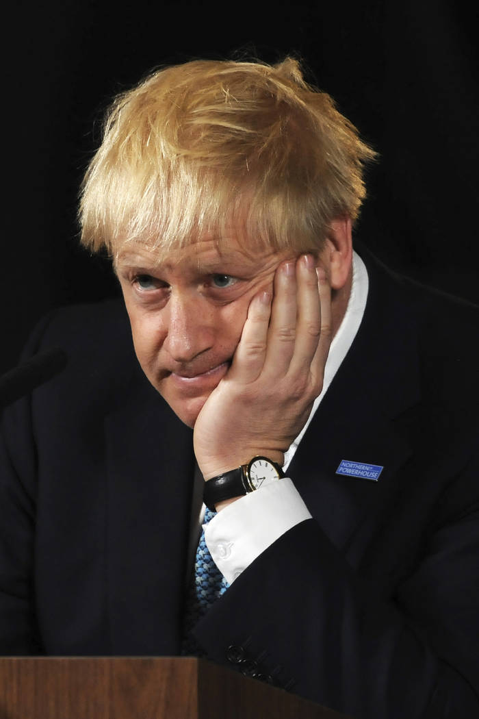 Britain's Prime Minister Boris Johnson reacts during a speech on domestic priorities at the Sci ...