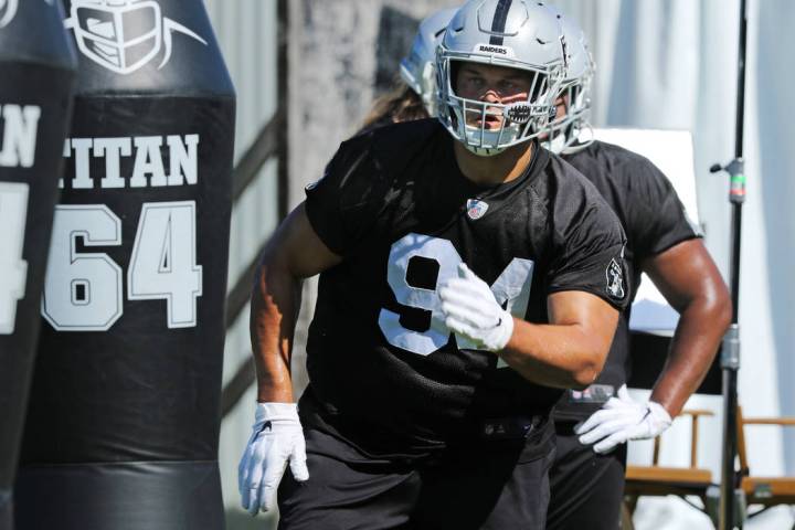 Oakland Raiders defensive tackle Eddie Vanderdoes (94) runs through a drill during the NFL team ...