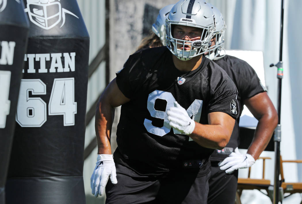 Oakland Raiders defensive tackle Eddie Vanderdoes (94) runs through a drill during the NFL team ...