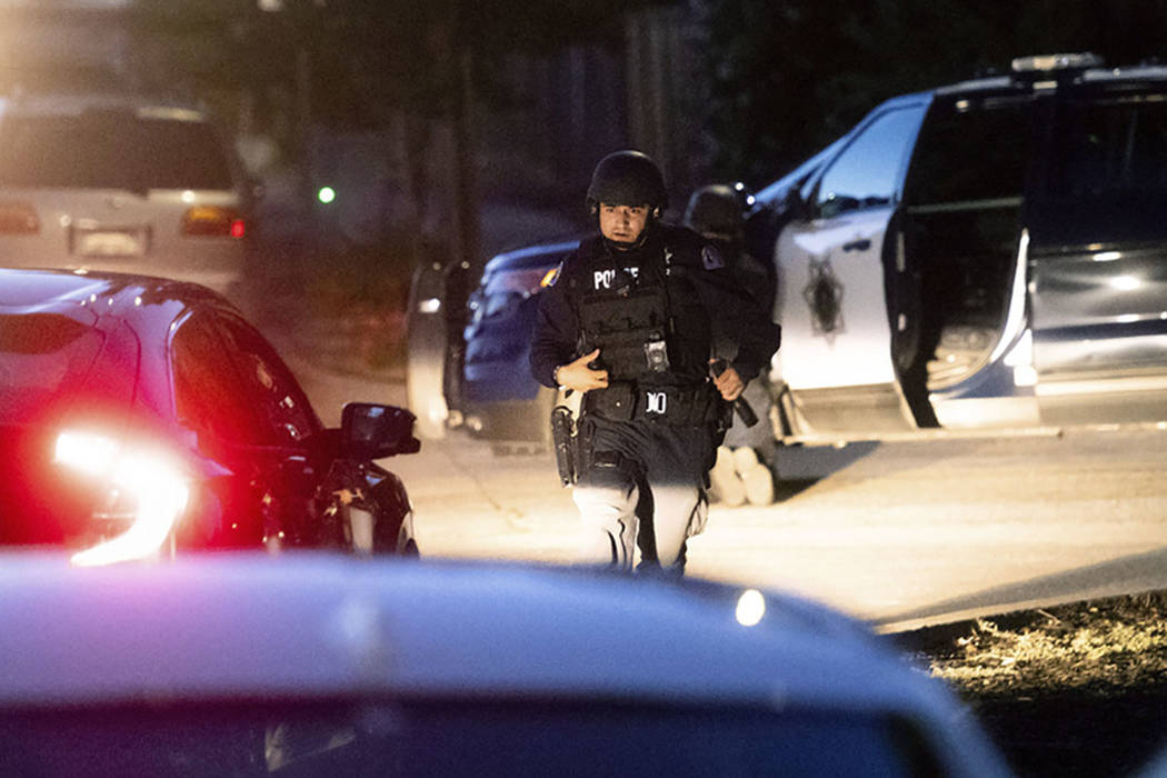 Police work a scene after a deadly shooting at the Gilroy Garlic Festival in Gilroy, Calif., Su ...