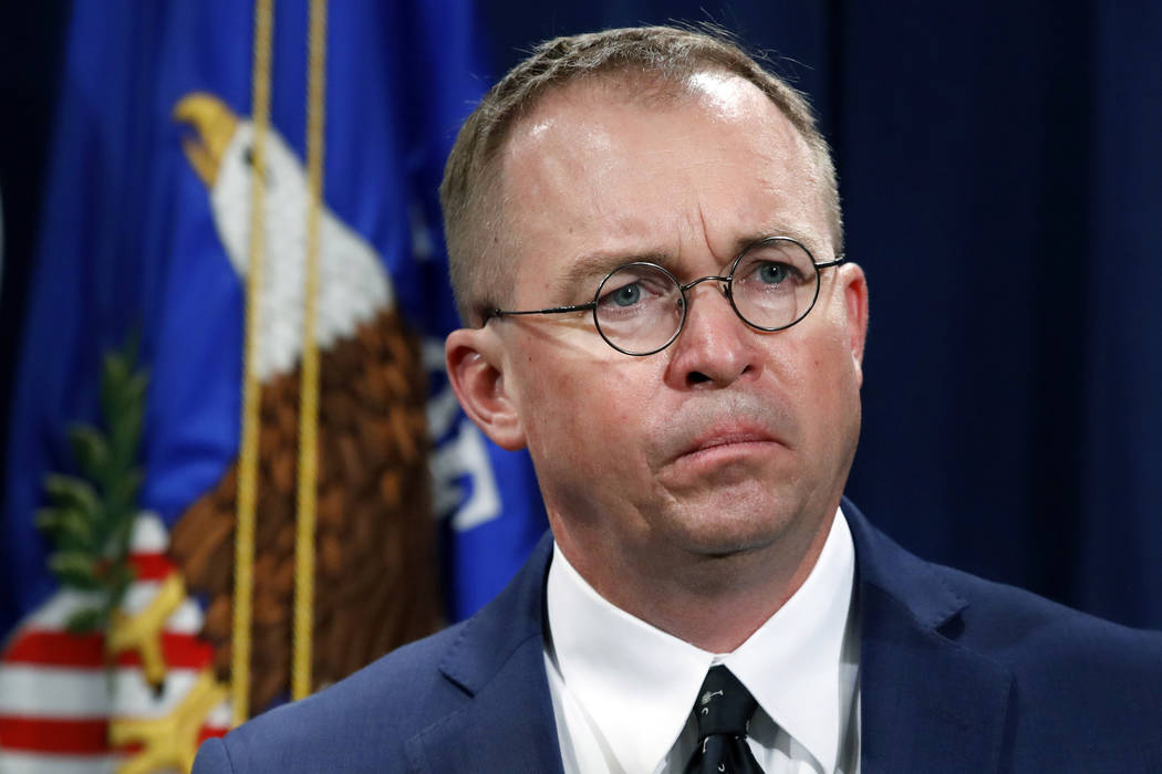 In a July 11, 2018, file photo Mick Mulvaney, listens during a news conference at the Departmen ...