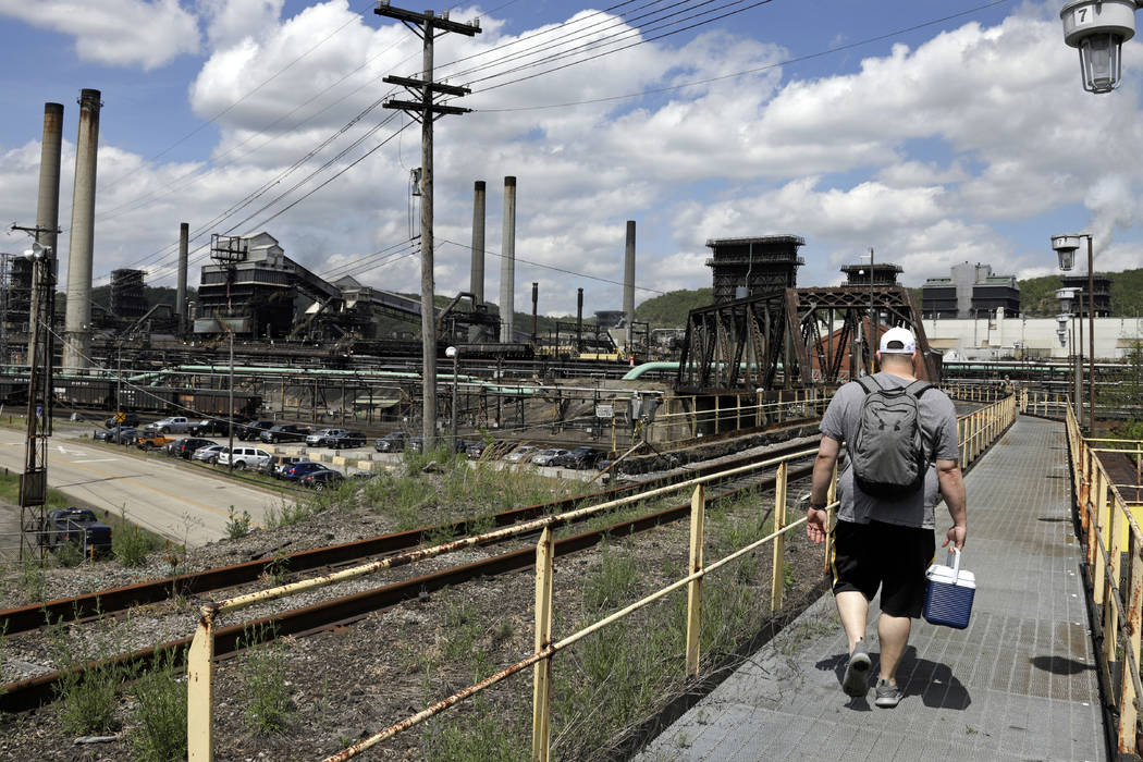 FILE - In this May 2, 2019, file photo a worker arrives for his shift at the U.S. Steel Clairto ...