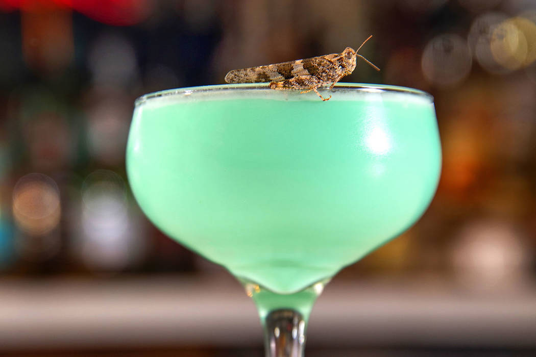 Grasshopper drink with grasshopper on the rim prepared by bartender Sarah Contois at the Smashe ...