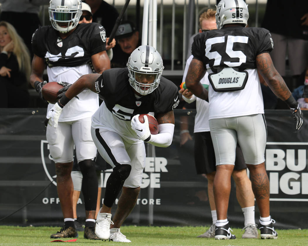 Oakland Raiders inside linebacker Brandon Marshall (54) runs with the football during the NFL t ...