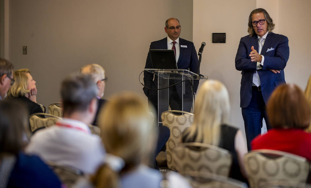 CEO Bob Maricich with the International Market Centers, right, speaks during a press conference ...