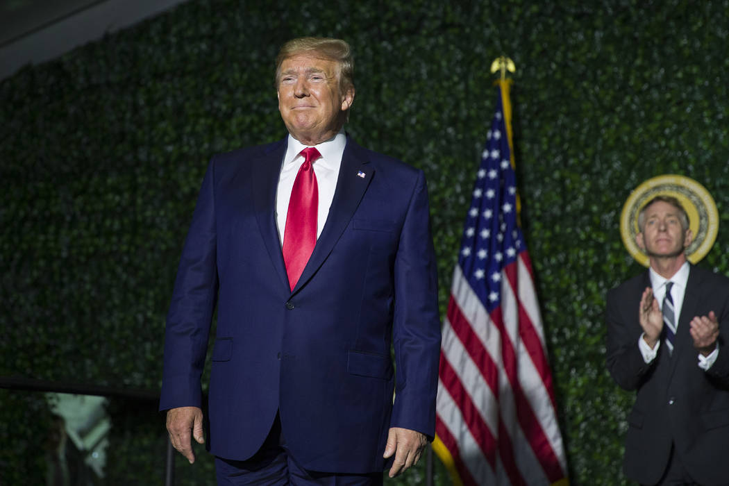 President Donald Trump arrives to speak at an event marking the 400th anniversary of the first ...