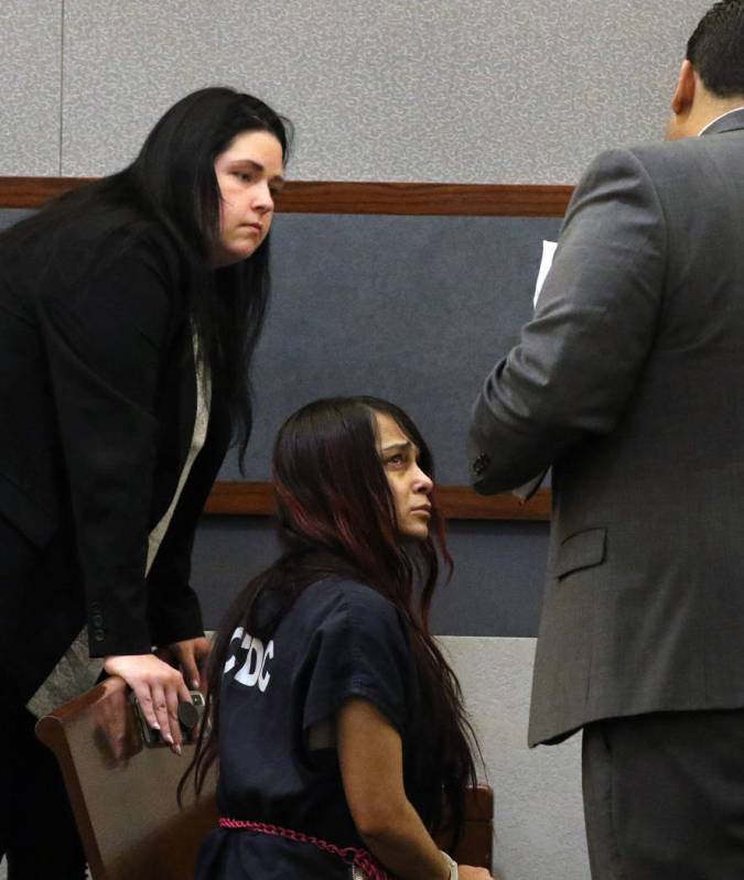 Gigi Mitchell, center, accused of trafficking an 11-year-old girl, appears in court with her de ...