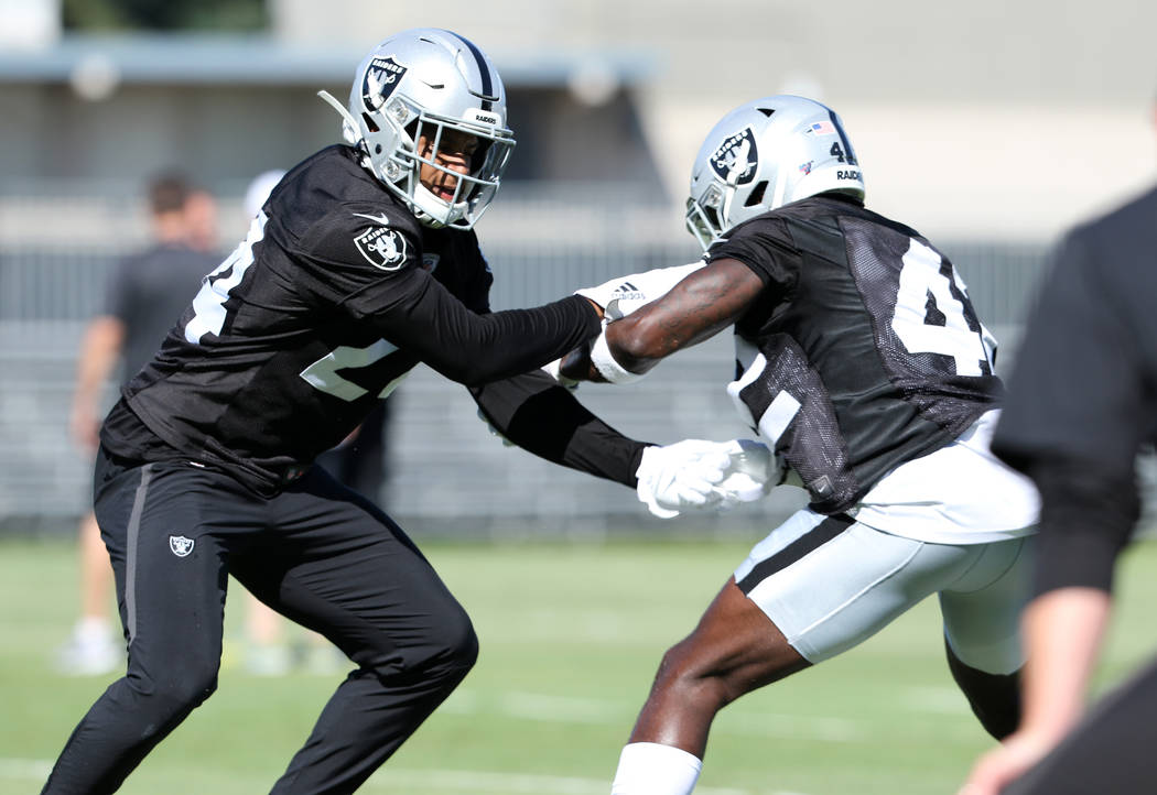 Oakland Raiders safety Johnathan Abram (24), left, and free safety Karl Joseph (42) drill durin ...
