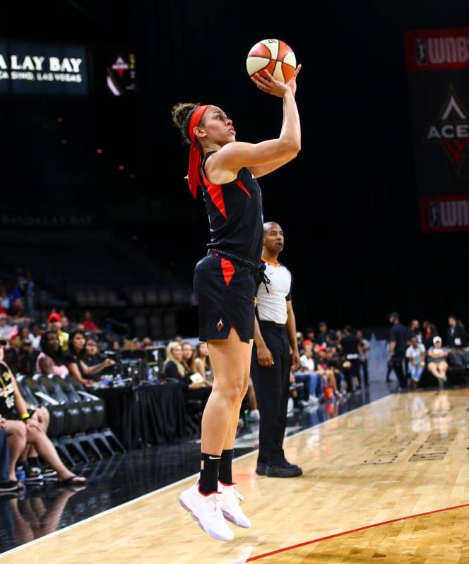 Las Vegas Aces' Dearica Hamby (5) shoots against the Dallas Wings during the first half of a WN ...