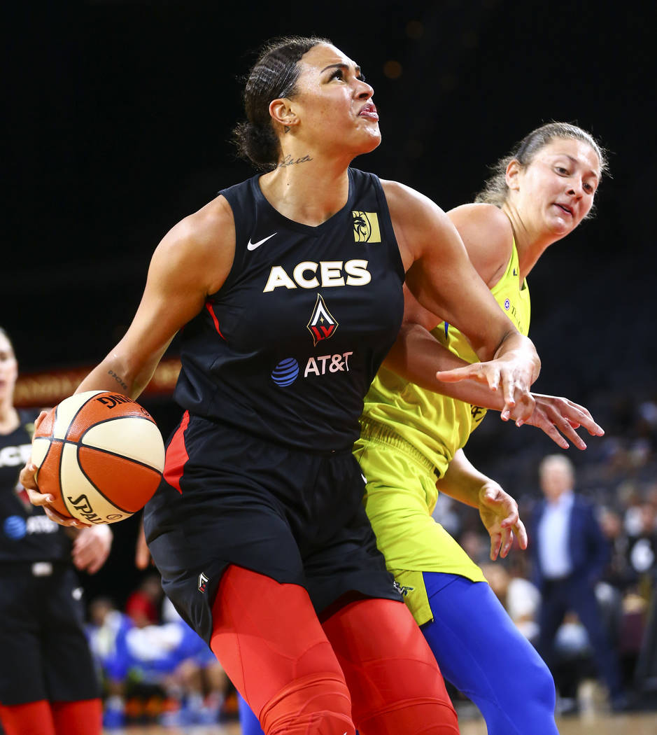 Las Vegas Aces' Liz Cambage drives to the basket against Dallas Wings' Theresa Plaisance during ...