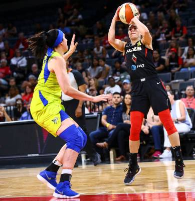 Las Vegas Aces' Kelsey Plum shoots over Dallas Wings' Megan Gustafson during the first half of ...