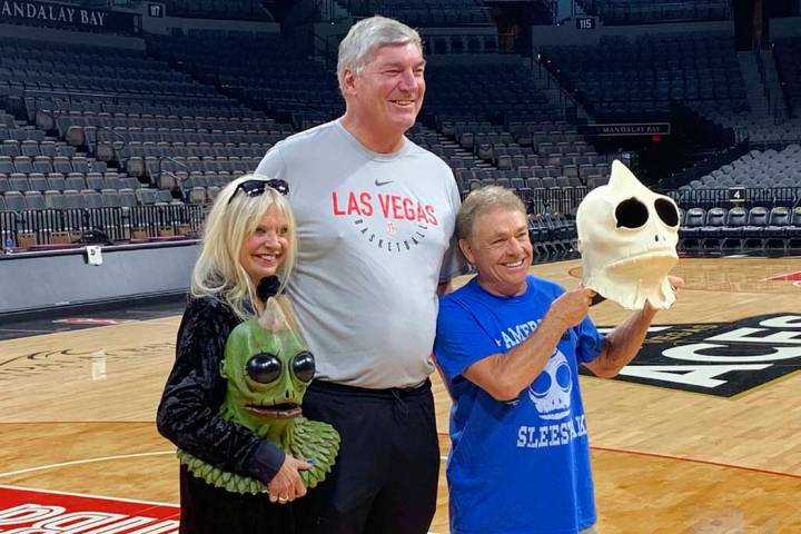 Bill Laimbeer, center, coach of the WNBA's Las Vegas Aces basketball team, poses for photos wit ...