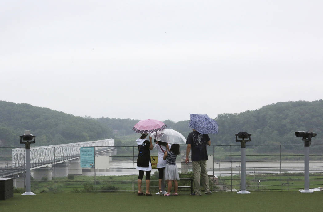 Visitors watch the North Korean side at the Imjingak Pavilion in Paju, near the border with Nor ...