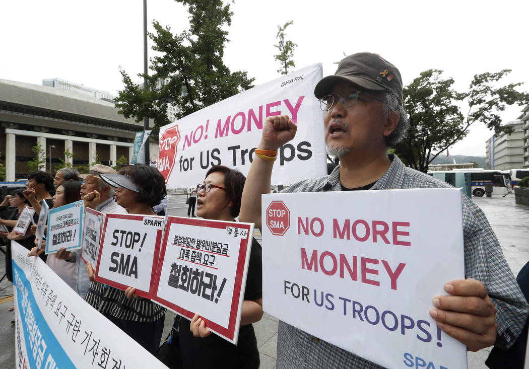 South Korean protesters shout slogans during a rally demanding withdrawal of the U.S. troops fr ...