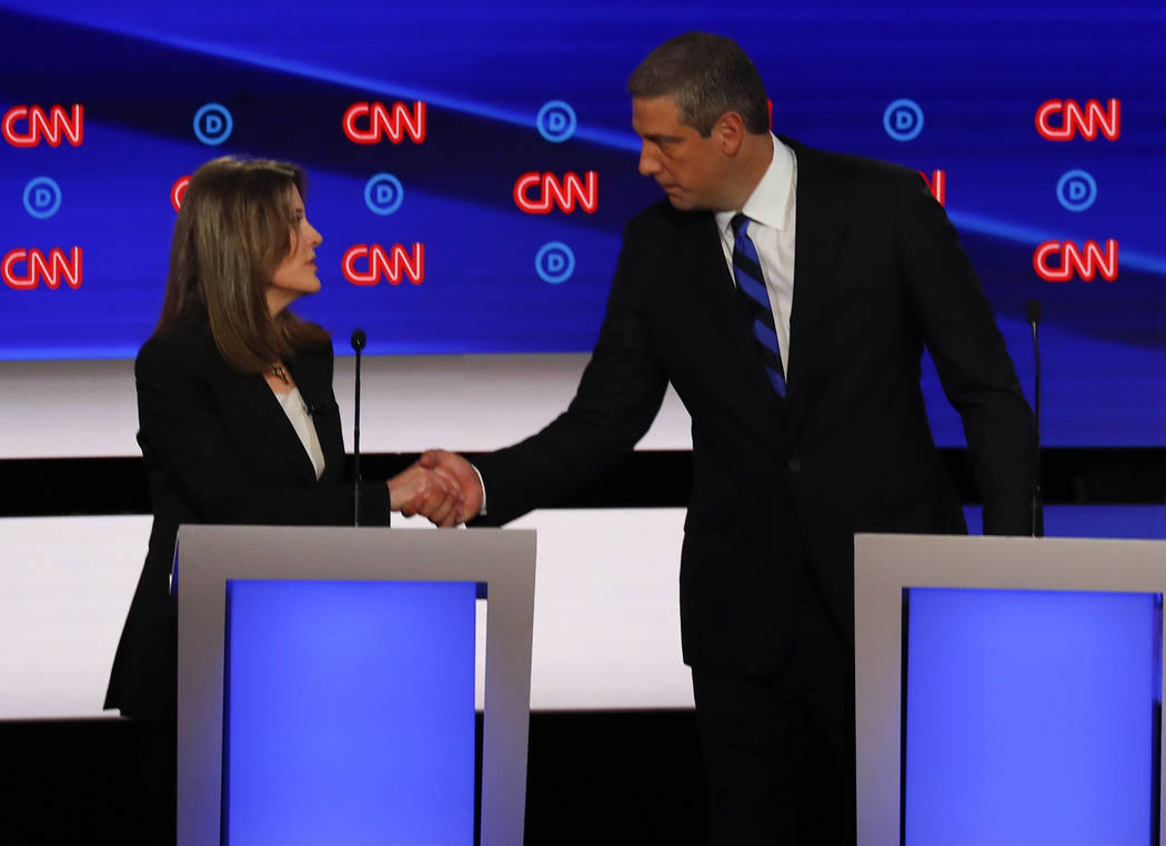 Marianne Williamson and Rep. Tim Ryan, D-Ohio, shake hands after the first of two Democratic pr ...