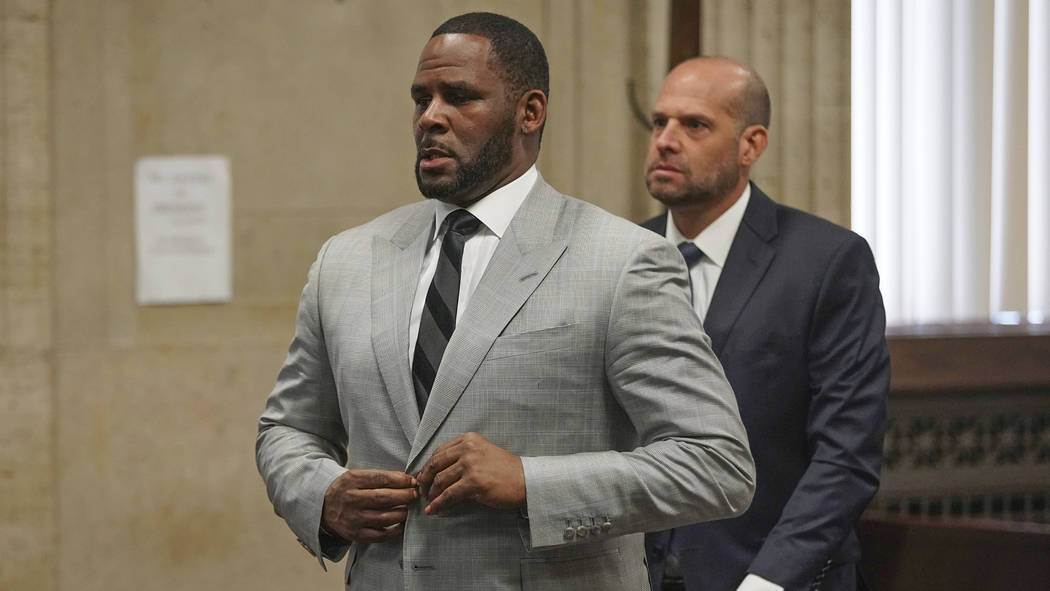 FILE - In this June 6, 2019, file photo, singer R. Kelly pleaded not guilty to 11 additional se ...