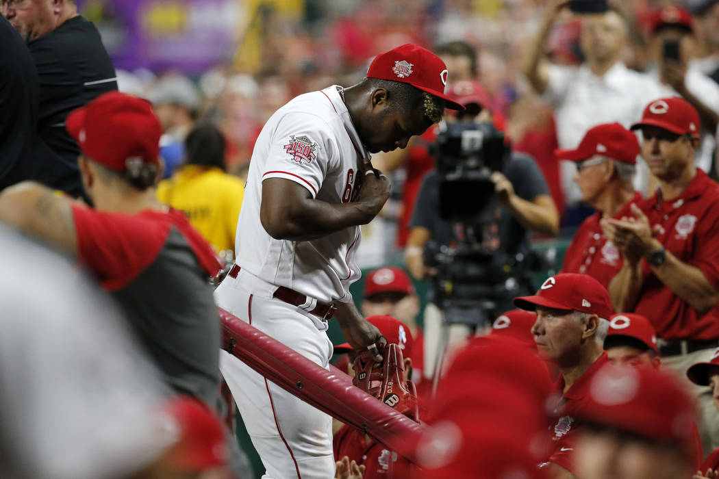 Cincinnati Reds right fielder Yasiel Puig leaves the field at the end of the top of the ninth i ...