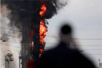 Flames and smoke rise after a fire started at an Exxon Mobil facility, Wednesday, July 31, 2019 ...