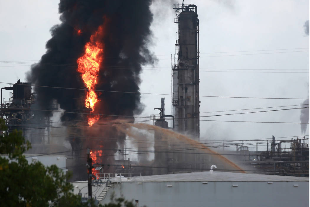 Flames and smoke rise after a fire started at an Exxon Mobil facility, Wednesday, July 31, 2019 ...