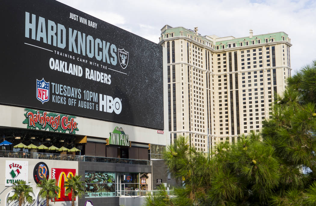 A digital billboard displays an advertisement for the upcoming season of "Hard Knocks&quot ...